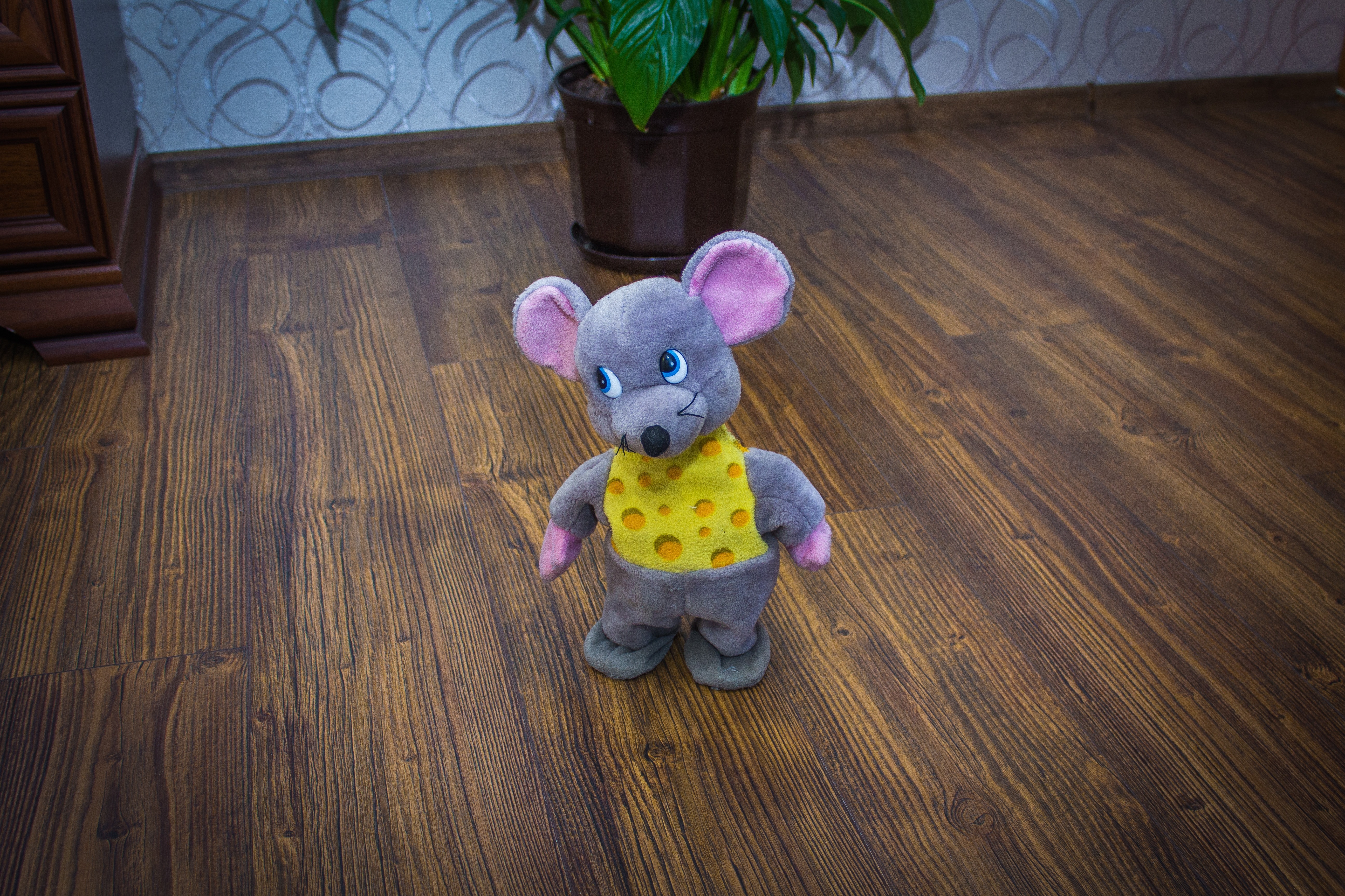 gray and yellow rat plush toy