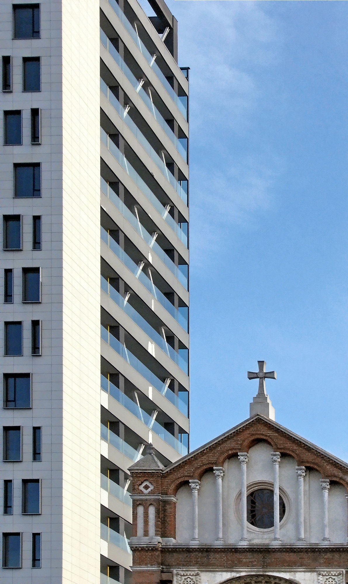 white and brown concrete cathedral and white and brown high rise building