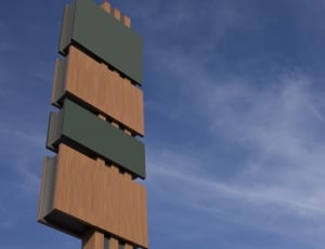 brown and green wooden stand during daytime photo thumbnail