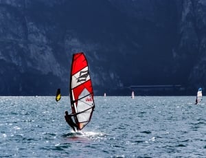 white red and black sail board thumbnail