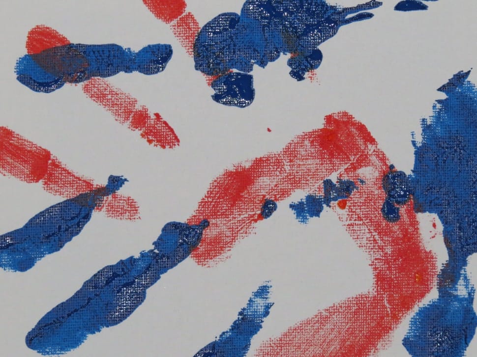 close up photo of blue and red hand marks preview