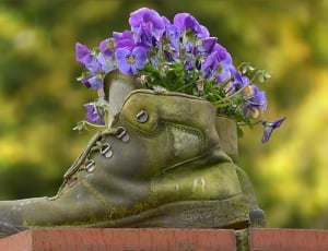 pair of brown and green high top sneakers with purple flowers thumbnail