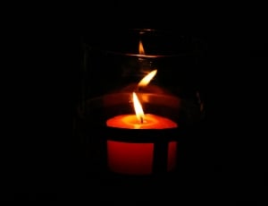 votive candle in dim light thumbnail