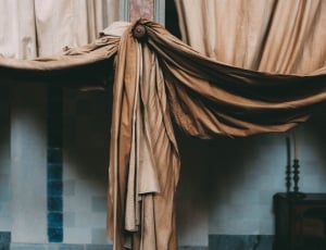 brown curtain wrapped in the middle thumbnail