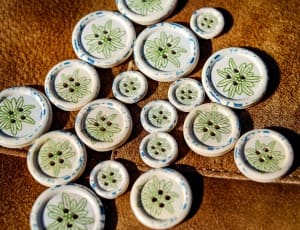 green and white floral round pin thumbnail