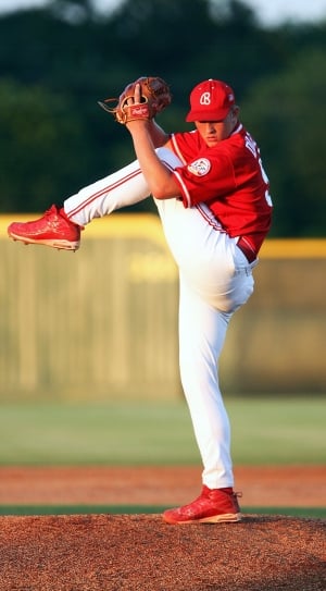 baseball player in red and white uniform thumbnail