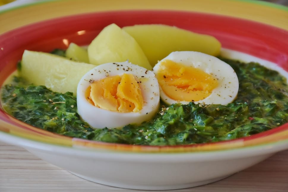 white ceramic plate with cooked union soup and egg preview