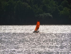 black and orange camataran boat thumbnail