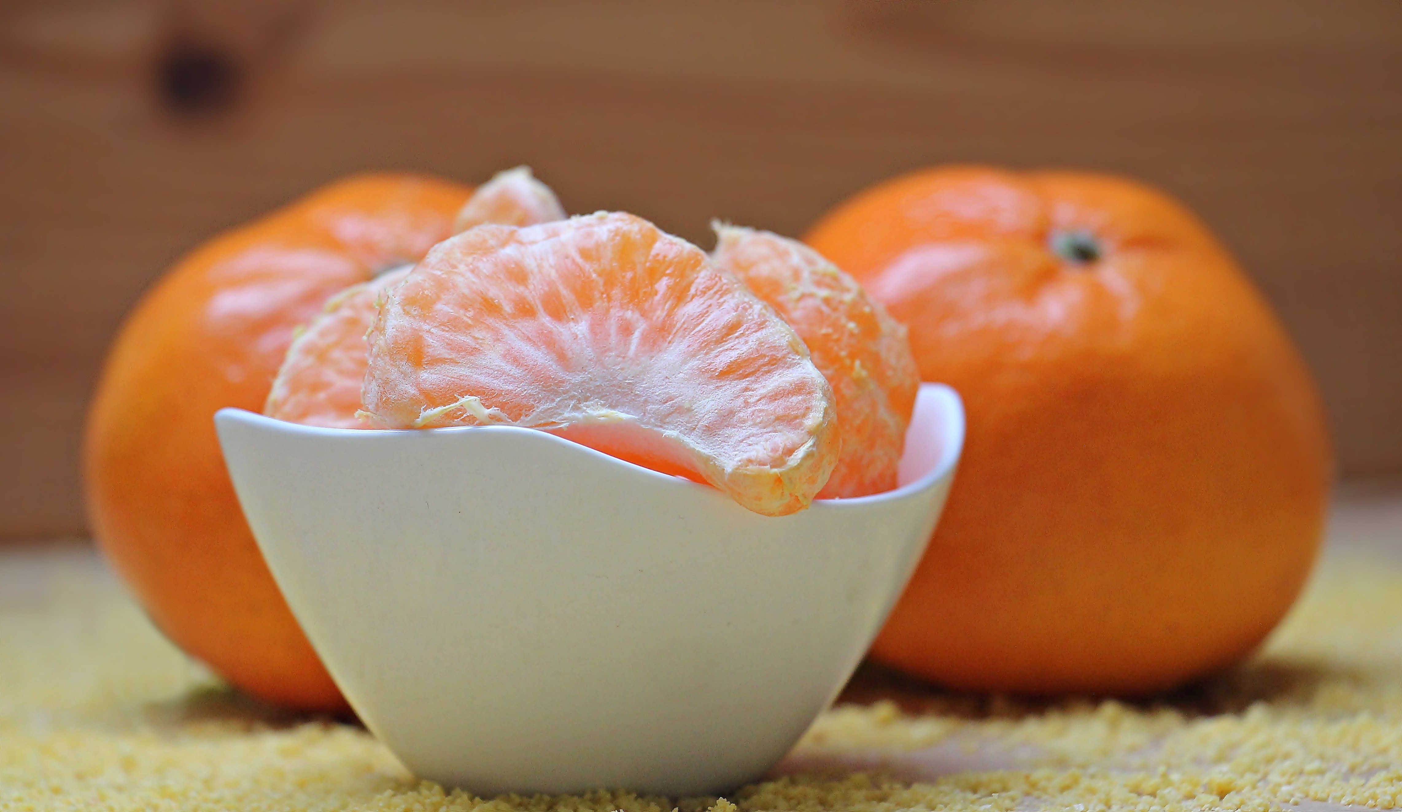 orange fruits on white round bowl