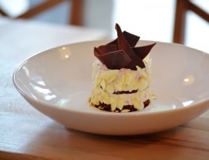 chocolate pastry on white ceramic bowl on top of brown wood surface on selective focus photography thumbnail