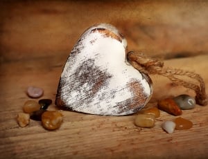 brown wooden heart pendant in close up photography thumbnail