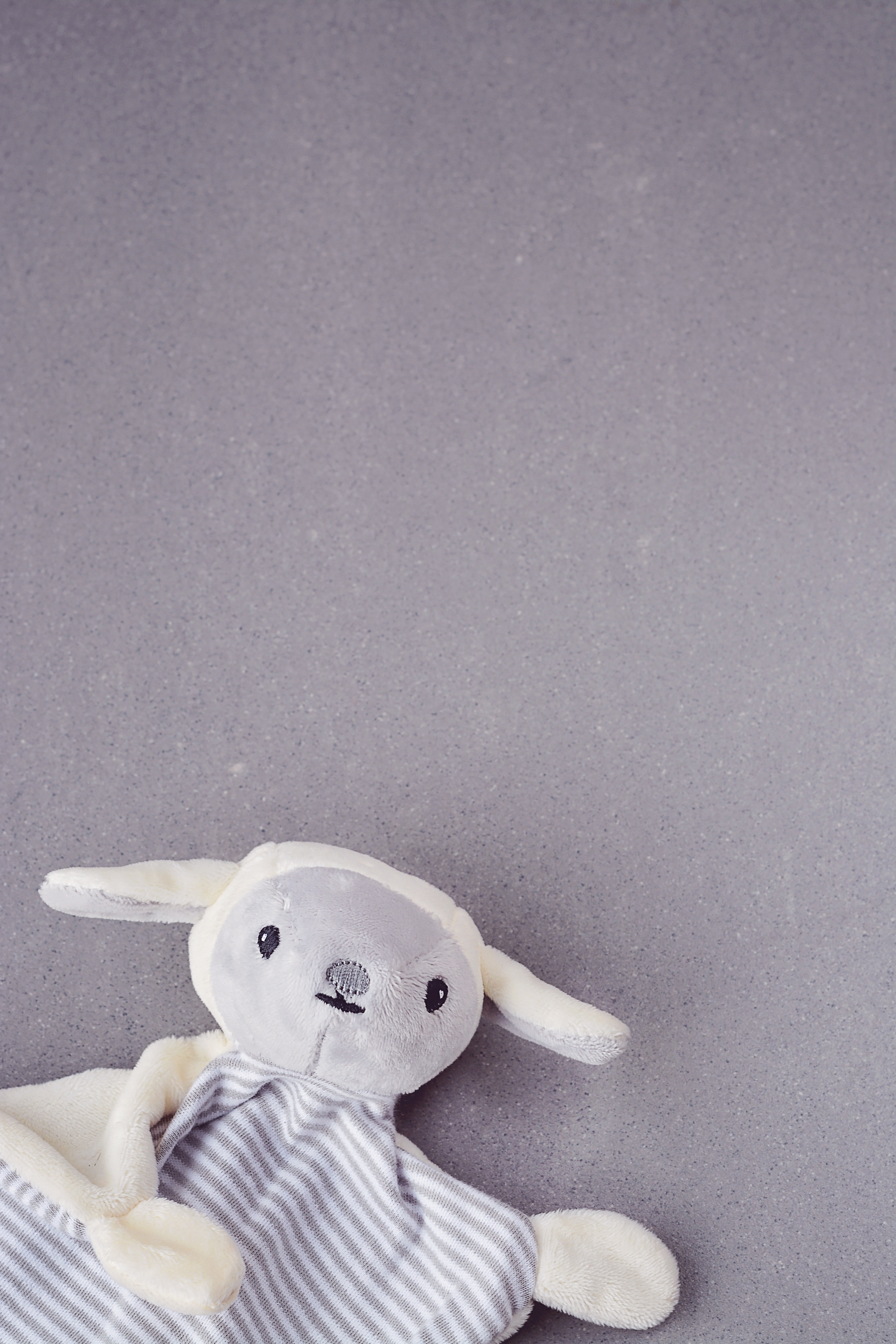 white and grey sheep plush toy