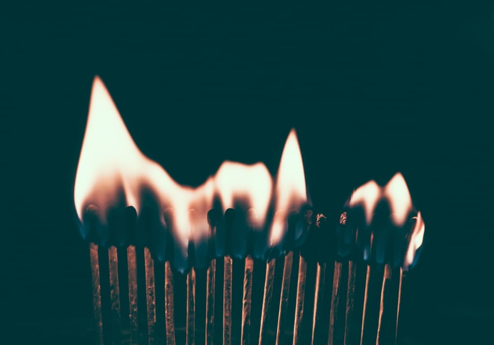 photograph of line of flaming match sticks preview