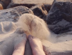 human feet on sand thumbnail