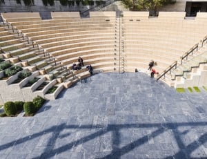 group of people sitting on the staircase thumbnail