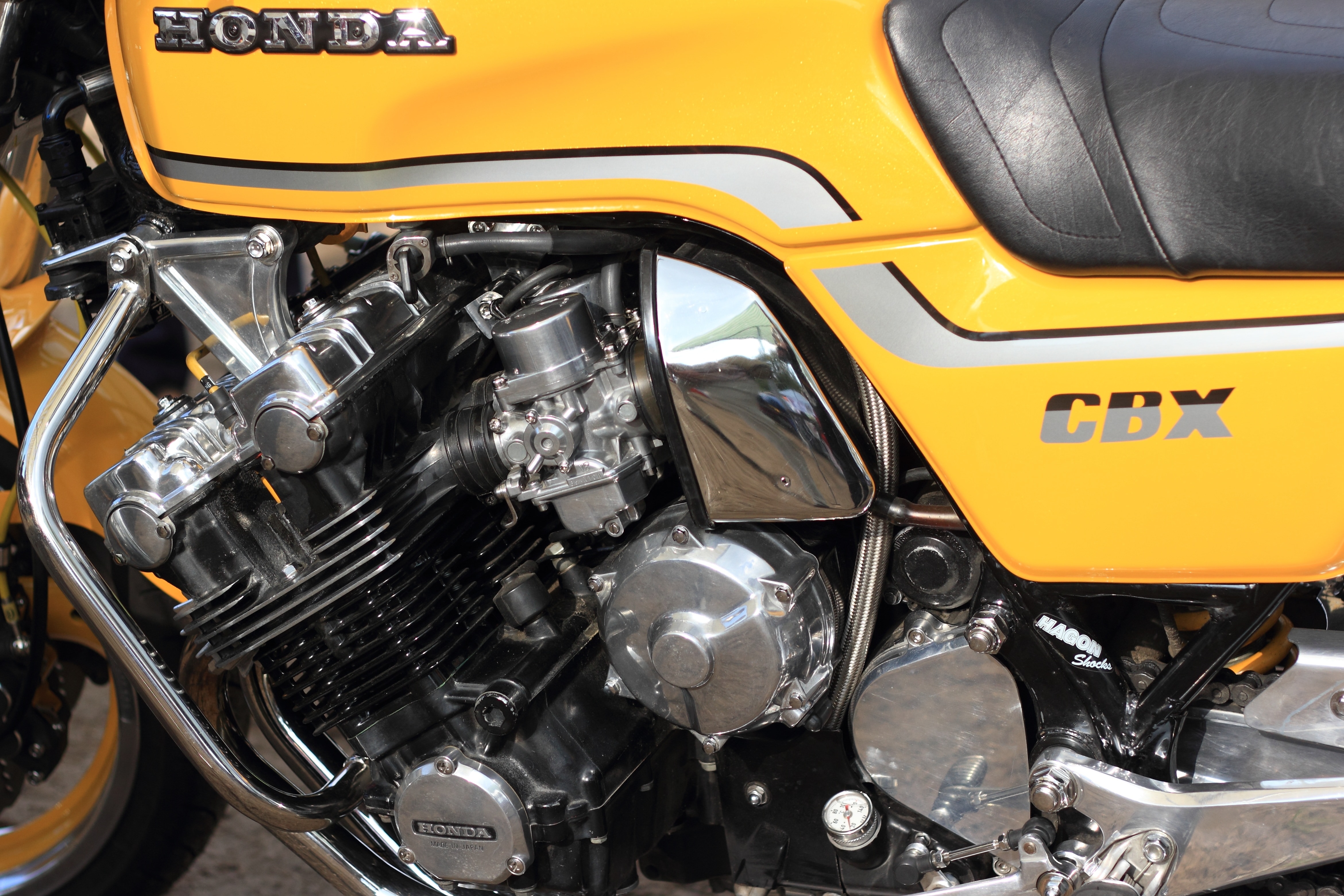 yellow and black Honda naked motorcycle