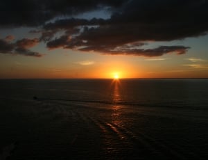 sunset over ocean photo thumbnail