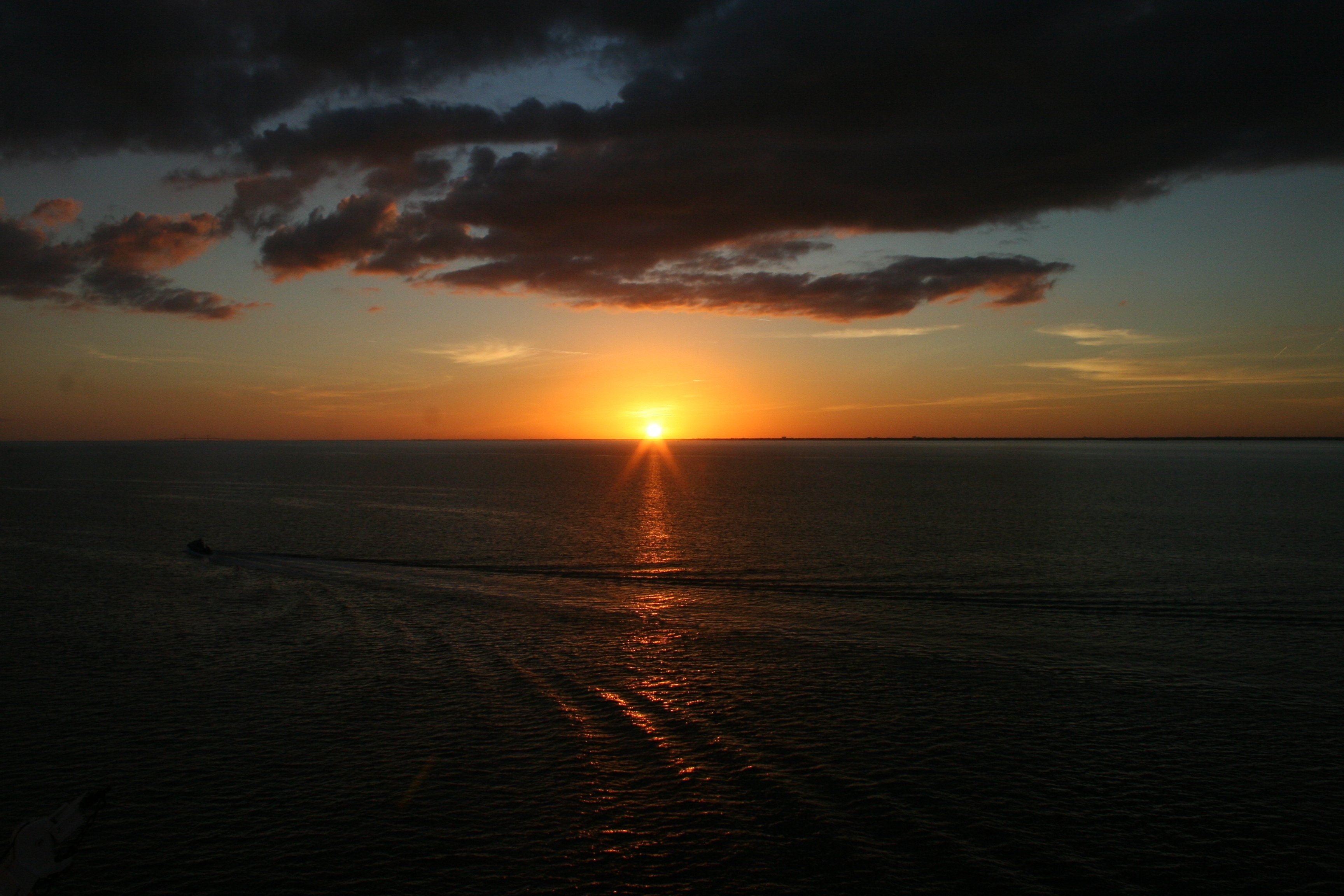 sunset over ocean photo