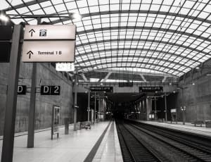 gray scale photo of train station thumbnail