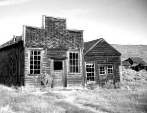 gray scale photo of wooden house thumbnail