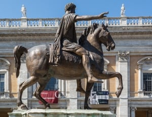 man in horse brown statue thumbnail
