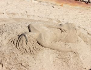 woman sand artwork thumbnail