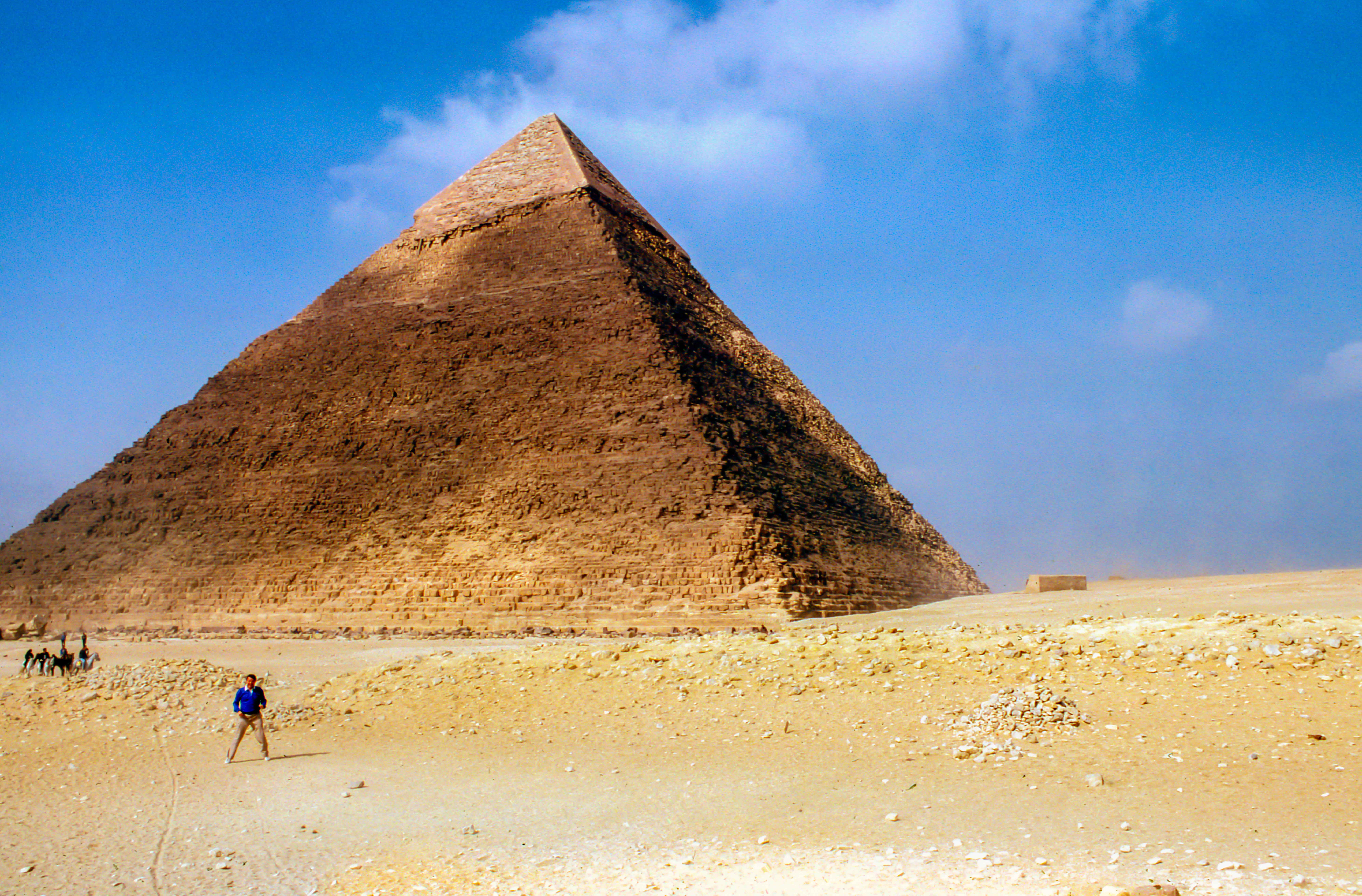 man standing near the pyramid during daytime