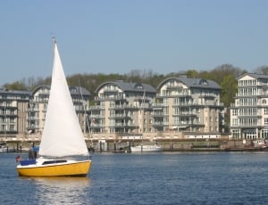 white and yellow sailboat thumbnail