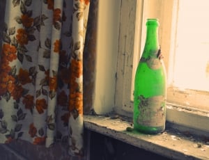 green and white bottle and orange gray and white flower print curtain thumbnail