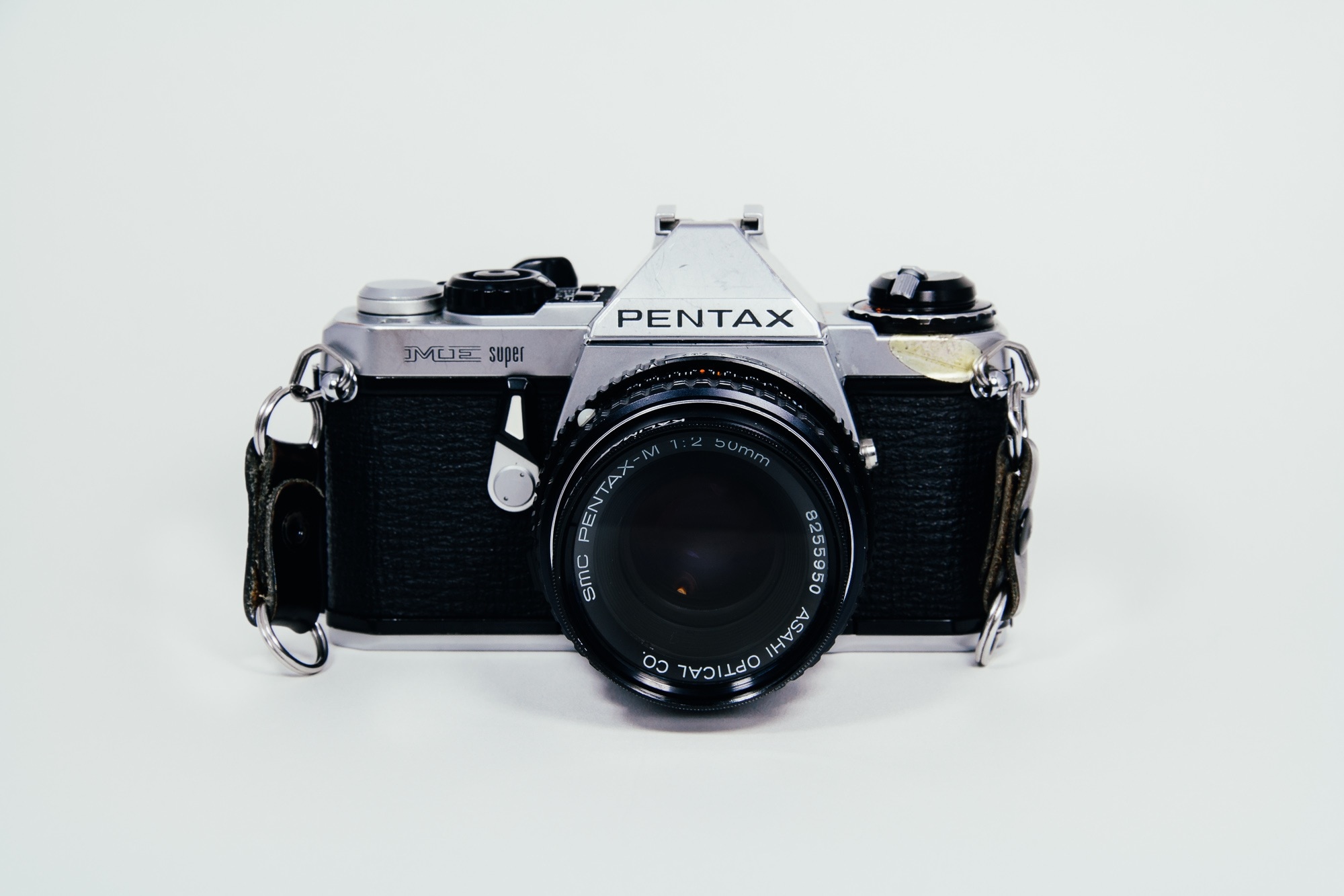 gray and black pentax dslr camera