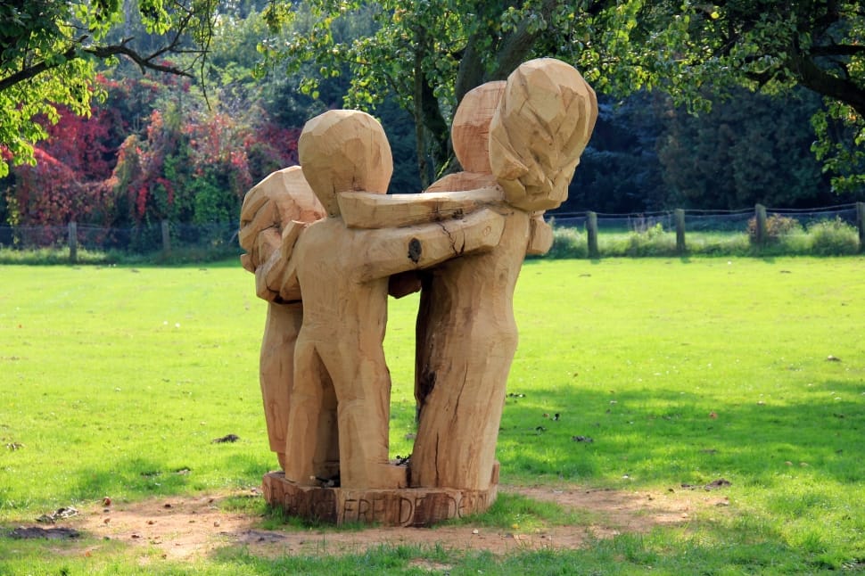 beige wooden statue of childrens preview