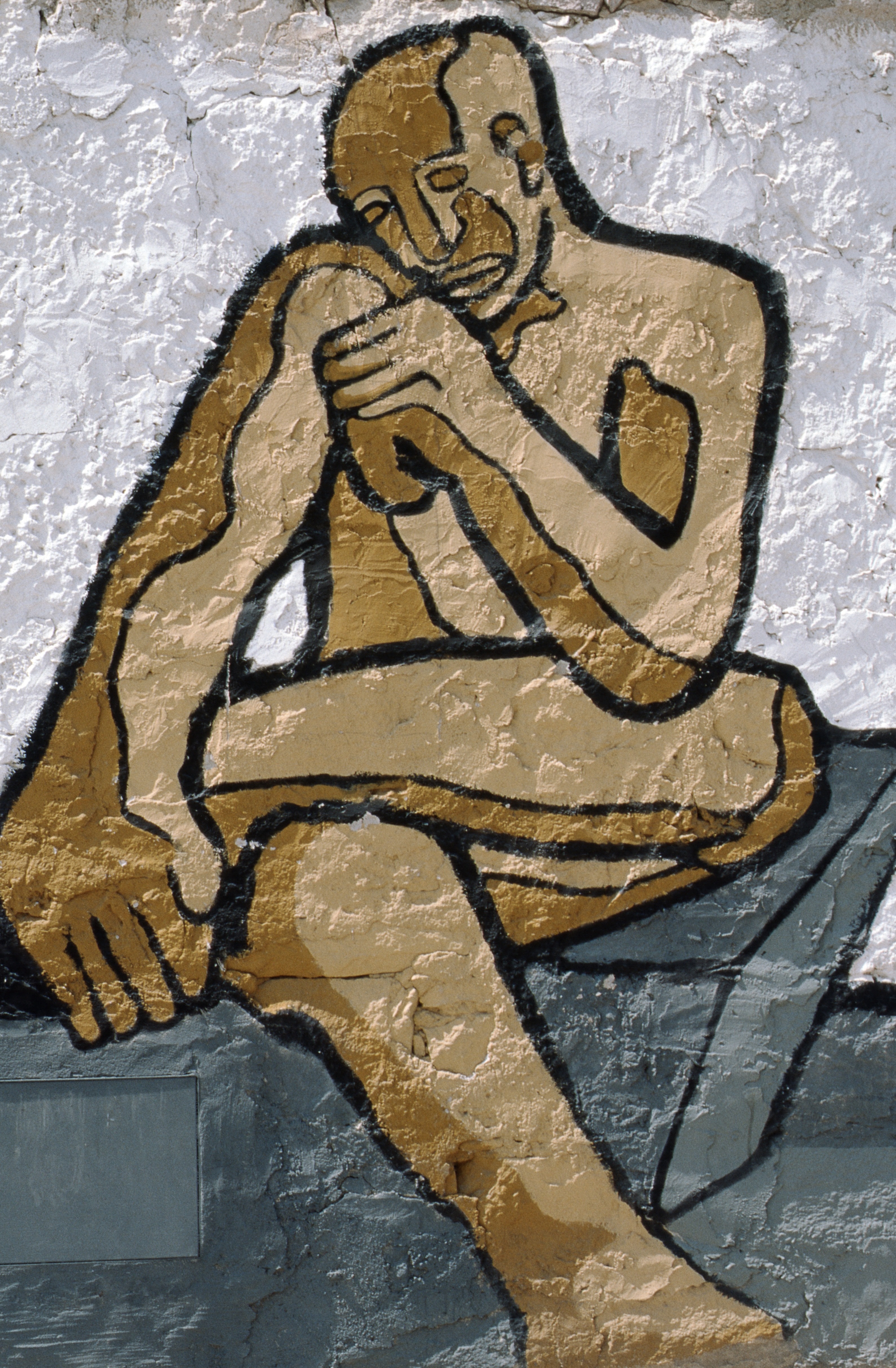 painting of man on wall during daytime