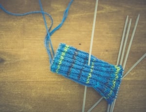 blue knitted textile with knit pins thumbnail