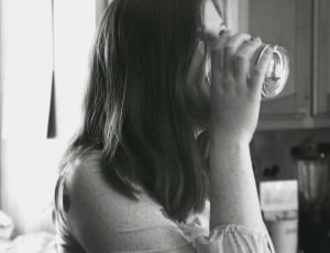 woman drinking on rock glass thumbnail