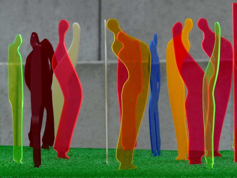 human figures plastic figurines on green surface preview