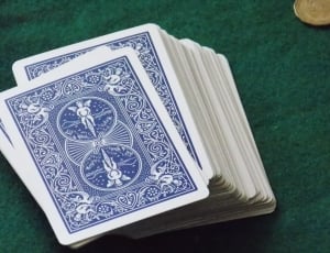 playing card set on green casino table thumbnail