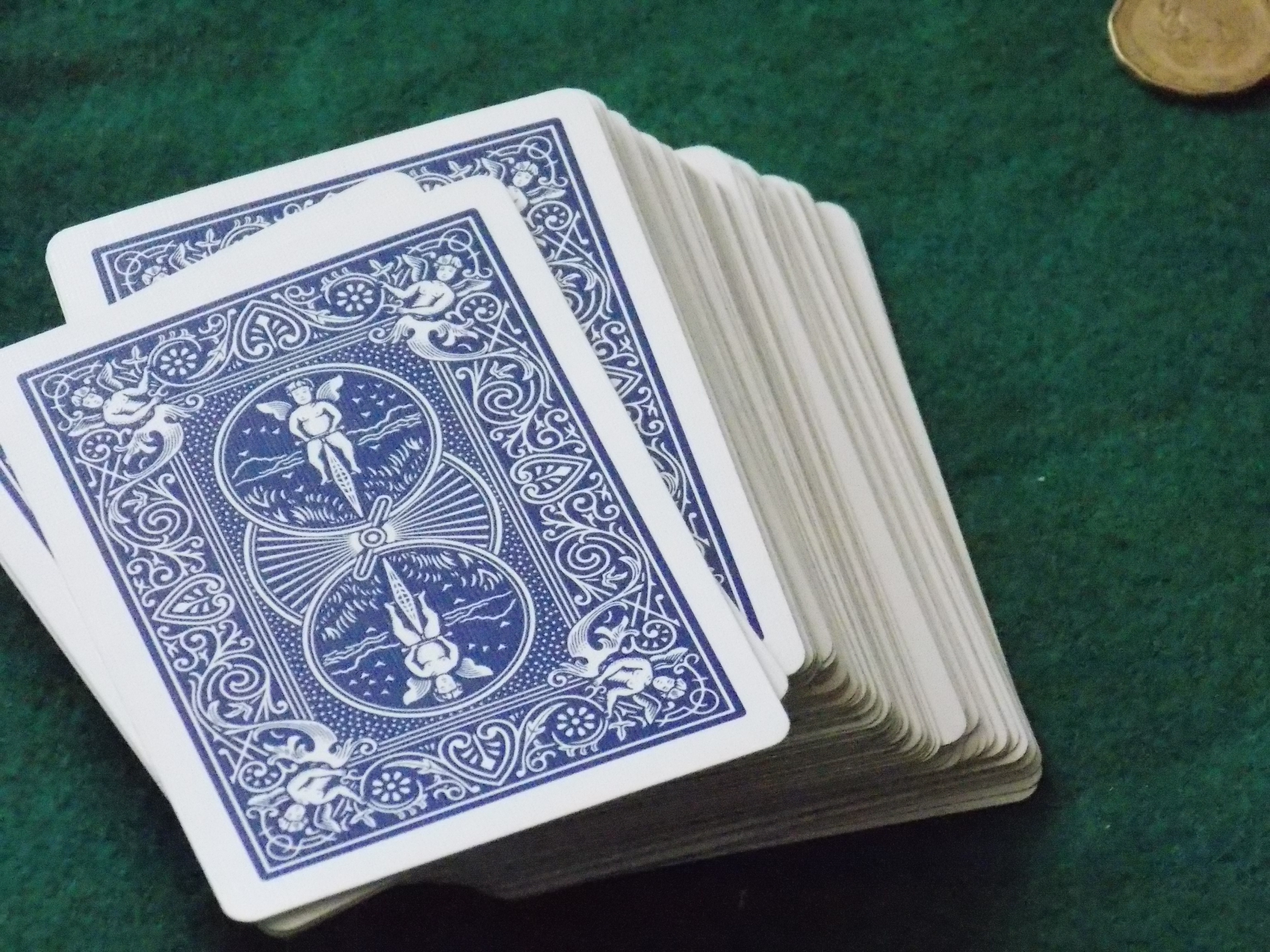 playing card set on green casino table