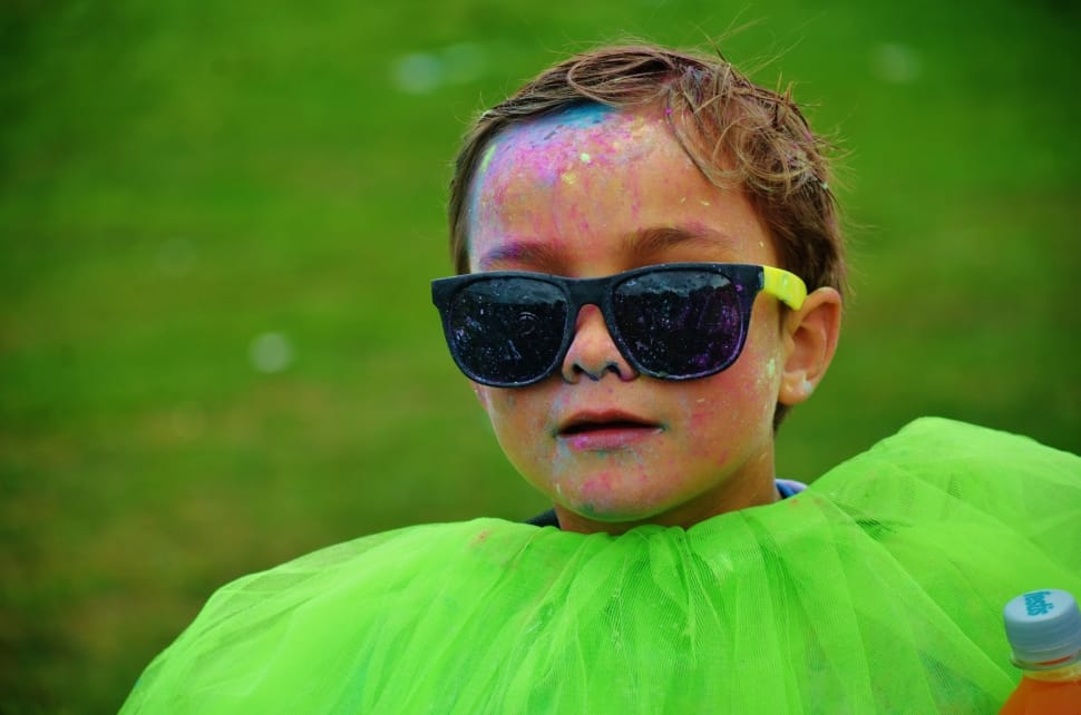 boy with black wayfarer style sunglasses covered with paint preview