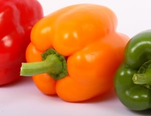 red, orange and green bell peppers thumbnail
