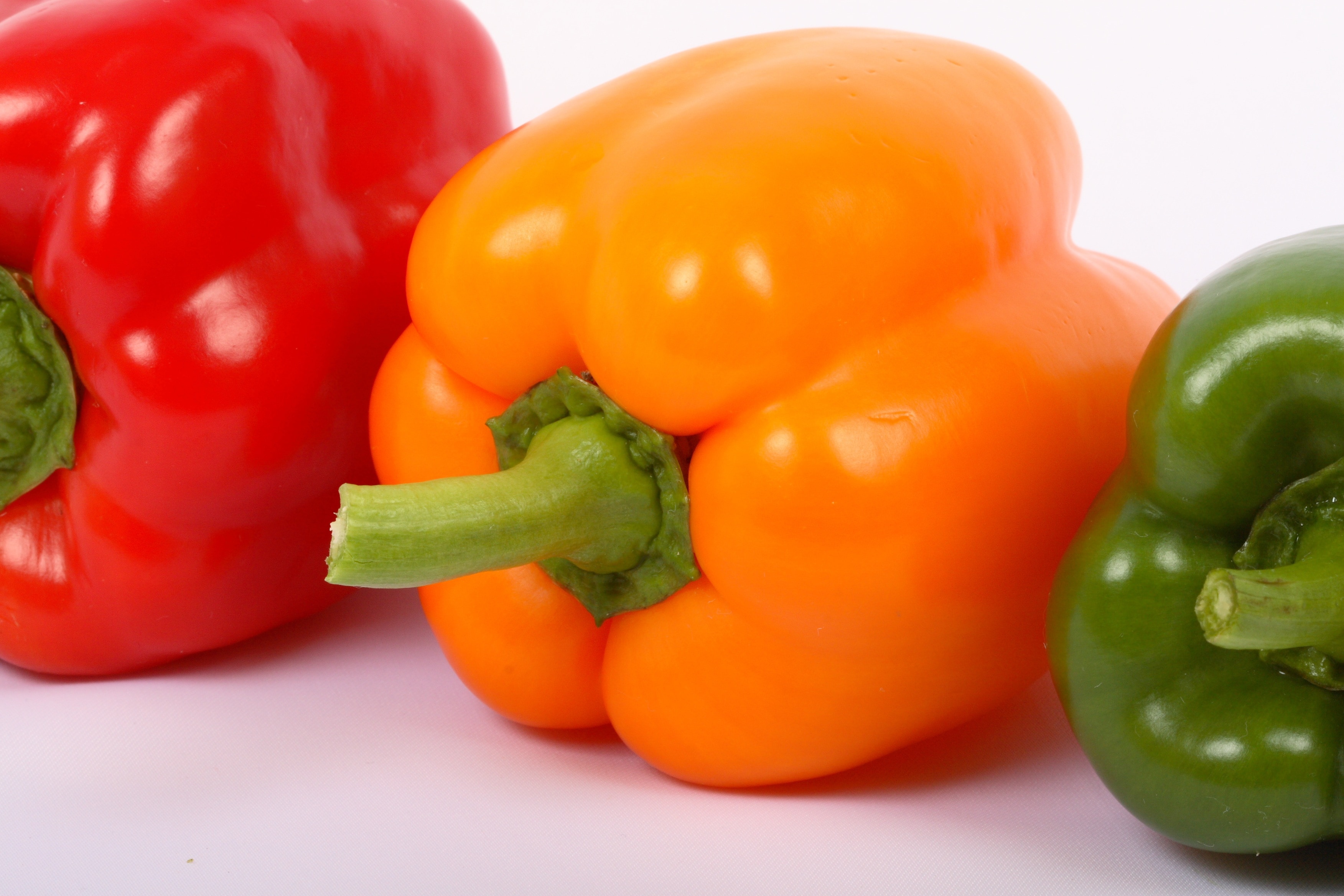 red, orange and green bell peppers