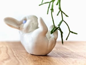 white ceramic duck figurine thumbnail