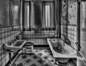 grayscale photo of toilet roomn thumbnail