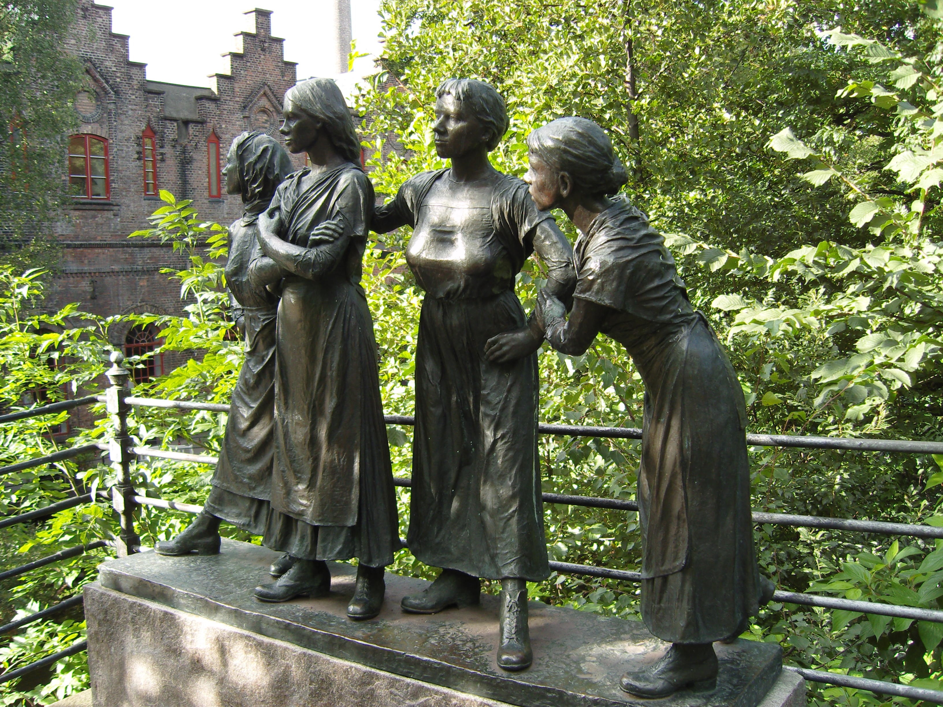 4 woman statuettes