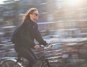 woman in black shirt riding bicycle thumbnail