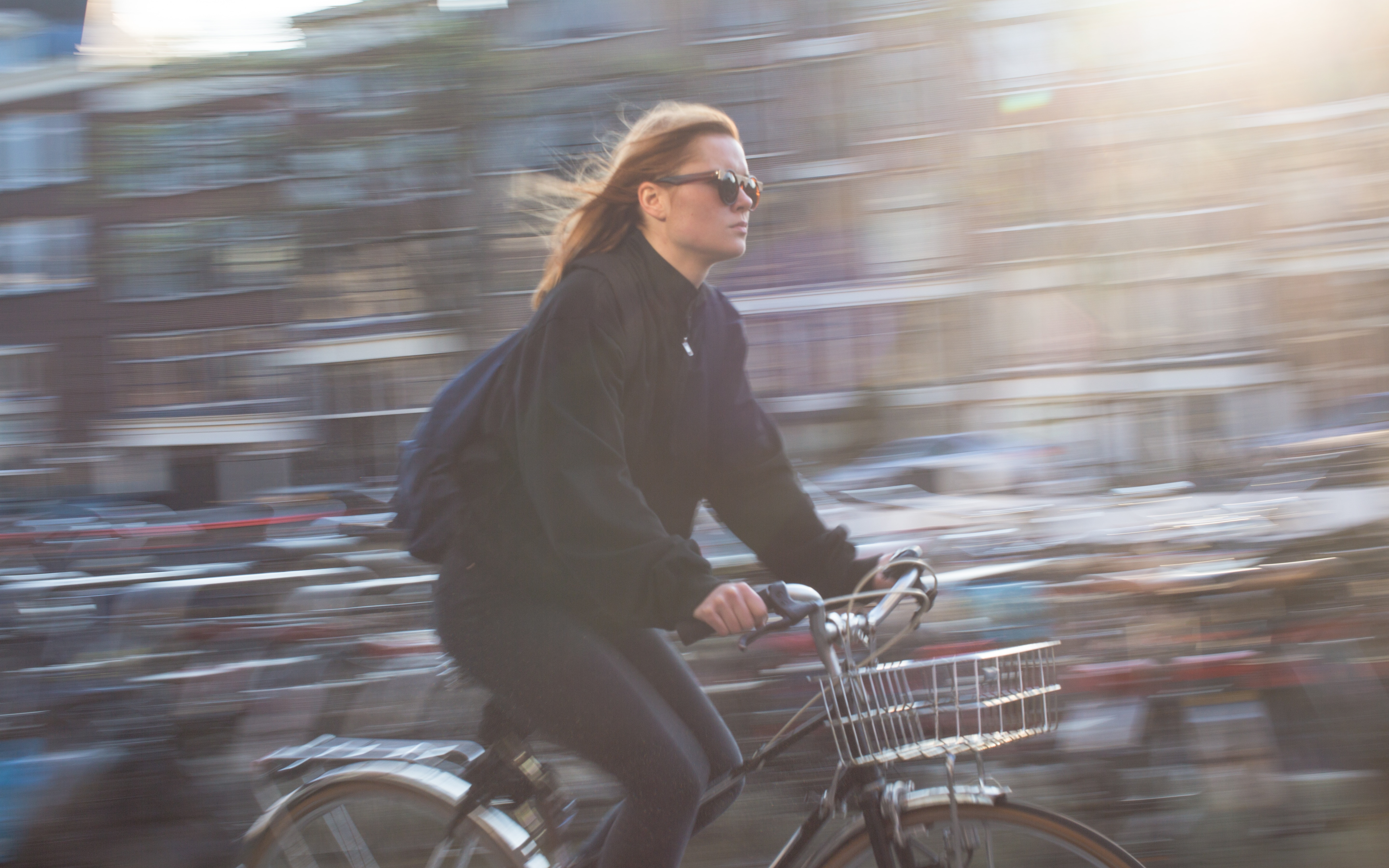 woman in black shirt riding bicycle