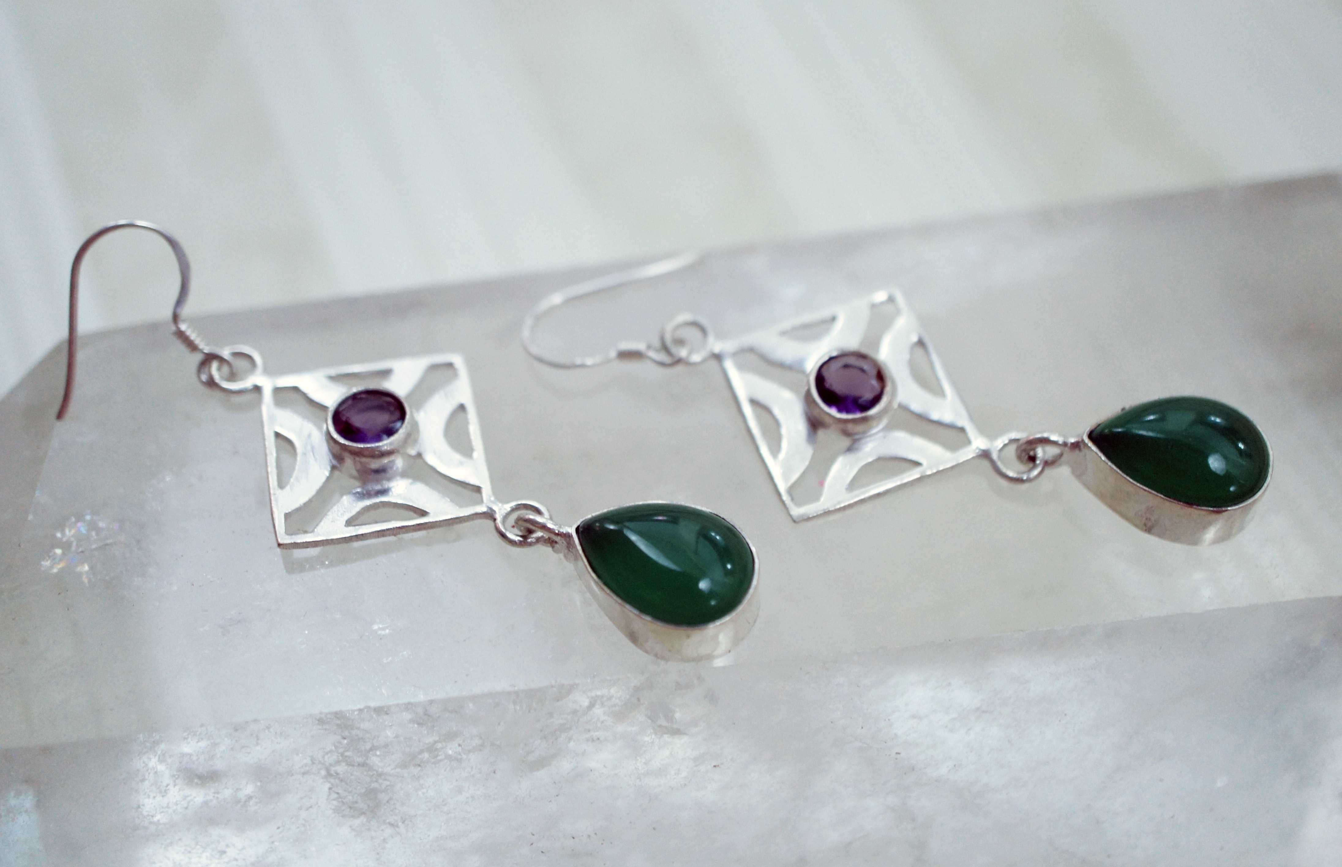 women's silver and green dangling earrings