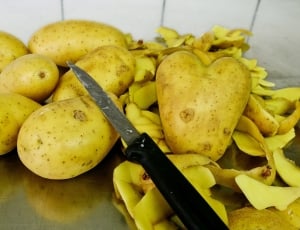 potato with knife on kitchen thumbnail