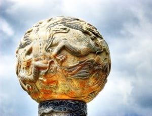beige round dragon emboss statue thumbnail
