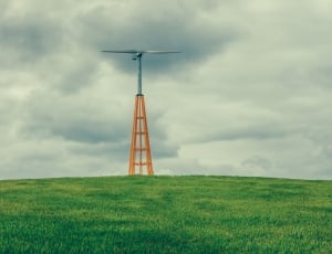 orange and gray tower on green open field thumbnail