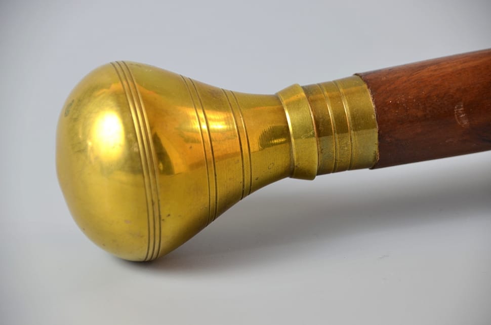 brass and brown wooden curtain rod preview